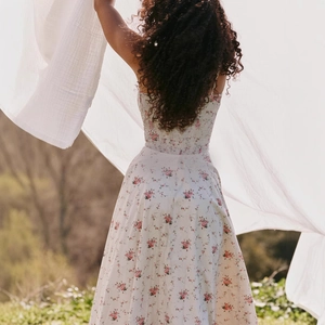 Floral embroidered backless maxi dress with adjustable straps and pink flower pattern