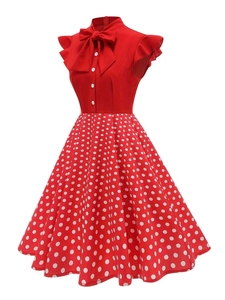 Detail of red vintage Hepburn dress with white polka dots and bow tie neckline