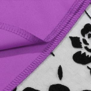 Macro detail of purple fabric with floral mesh lace and professional overlock stitching