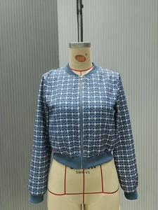 Detailed front view of women's blue and white checkered zip-up jacket with ribbed cuffs