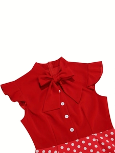 Detail of vintage red dress with bow collar, white buttons and polka dot ruffles