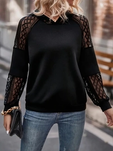 Detail of elegant black lace patchwork on sleeves of women's hooded sweatshirt