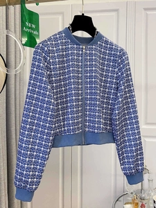 Detailed view of blue and white tweed texture on women zipper jacket with ribbed cuffs