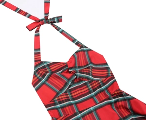 Detail showing the red plaid halter neckline with a tied bow and pleated chest design