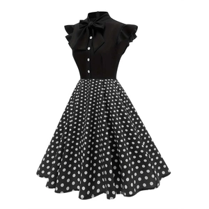 Vintage Audrey Hepburn style floral polka dot dress with large bow and A-line skirt