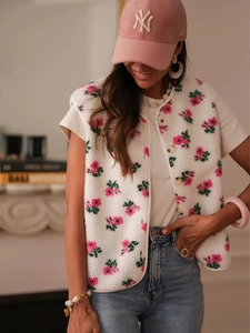 Close-up of floral double-sided fleece vest with single-breasted buttons and soft texture