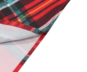 Close-up of tartan plaid fabric showing high-density stitching and twill texture detail