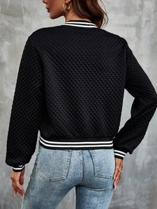 Back view of a black quilted baseball jacket with striped ribbing and lace details