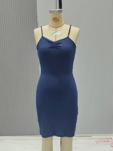 Detail of navy blue ribbed knit dress fabric and texture with bodycon fit