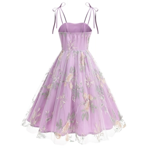 Detail of lavender dress with floral embroidery and adjustable bow shoulder straps