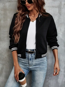 Detail of black quilted bomber jacket featuring striped ribbed collar and zipper closure