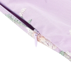 Detail of lavender cushion cover showing embroidery texture and high-quality hidden zipper