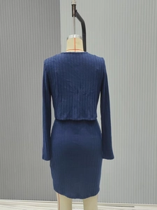 Detail view of the vertical ribbed knit texture on the back of this navy slim-fit dress