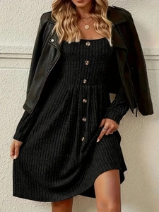 Detail of knit midi dress with vertical ribbing and buttons under a leather jacket