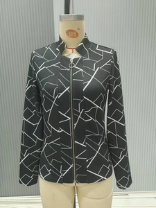 Detail of fashion black jacket with white geometric lines and stylish silver ring zipper