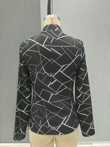 Detail view of black vintage jacket back featuring white geometric linear patterns