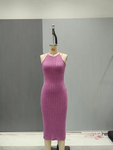Close-up of purple ribbed knit bodycon dress with sleek halter neck design