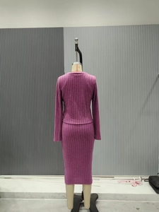 Detail of slim fit rose purple ribbed knit two-piece set showing back texture and fabric