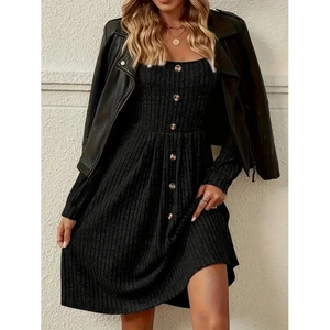 Elegant black knit dress with single-breasted buttons and stylish leather biker jacket