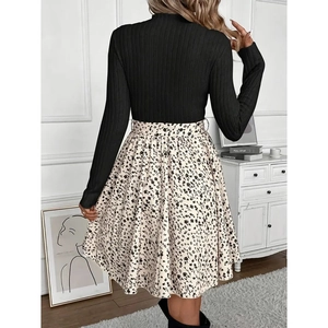 Elegant two-piece dress with black knit long sleeve top and beige floral print skirt