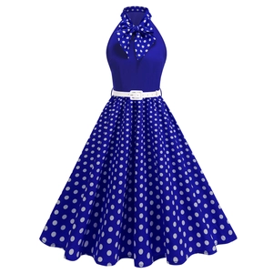 Detail of vintage 50s Audrey Hepburn navy polka dot dress with halter neck and bow