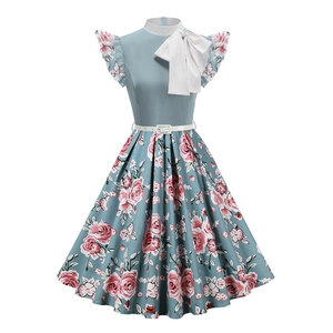 Vintage light blue floral dress with a white bow collar and A-line silhouette