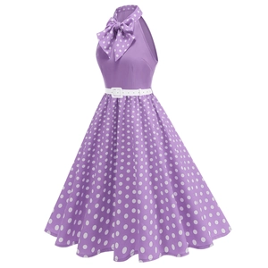 Detail of purple vintage polka dot dress featuring a halter neck and white waist belt