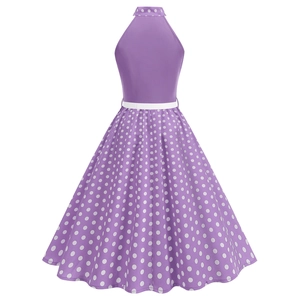 Back view of a purple vintage halter dress with white polka dots and a slim belt