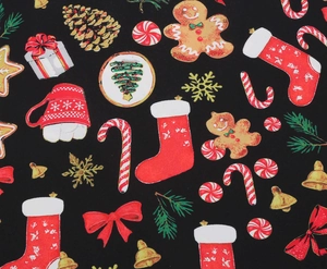 Close-up of vintage Christmas print featuring gingerbread men, bells and pine needles