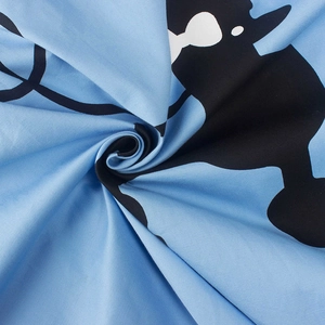 Light blue 50s vintage dress fabric with decorative black and white cartoon dog pattern