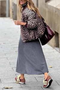 Street style view of reversible leopard print jacket styled with a burgundy tote bag