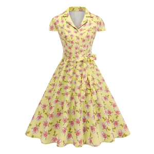 Retro 1950s style yellow floral dress with red roses, lapel collar, and belted waist