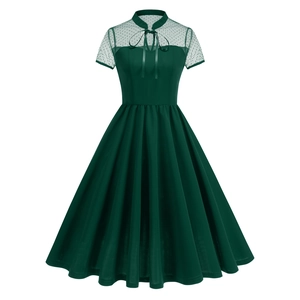 Dark green vintage dress with mesh polka dot short sleeves and a large A-line skirt