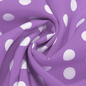 Detailed macro view of purple fabric with white polka dots for vintage Audrey dresses