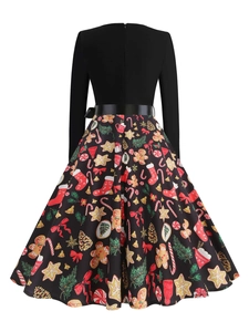 Back view of a Christmas dress featuring gingerbread men and holiday print patterns