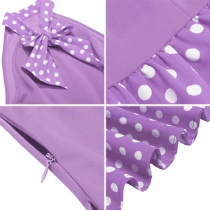 Detail view of purple polka dot dress showing bow waist, invisible zipper and hemline