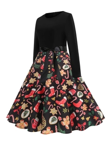 Detail of A-line Christmas dress showing festive gingerbread and candy cane print pattern