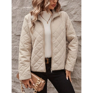 Elegant beige quilted diamond pattern jacket with standing collar and zip-up front for women
