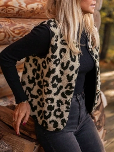 Detailed close-up of leopard print plush vest with front buttons and warm texture