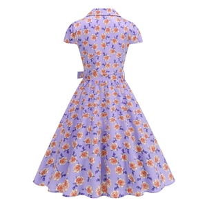 Detail view of the back of a vintage lilac A-line dress with orange rose floral prints