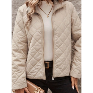 Elegant beige quilted jacket with diamond patterns and standing collar for modern women