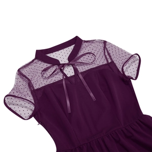 Detail of plum vintage dress featuring a mesh polka dot collar and satin bow tie