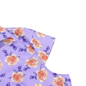 Detail shot of vintage purple floral print on casual short sleeve dress with rose patterns