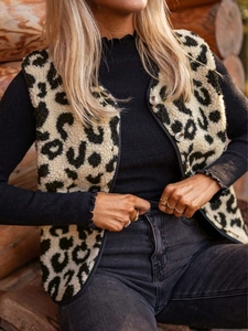 Close-up of leopard print faux shearling vest with front buttons for women's winter fashion