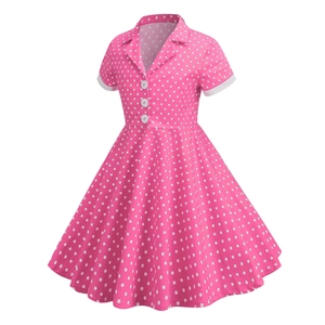 Pink polka dot vintage girls dress with white lapel collar and A-line skirt