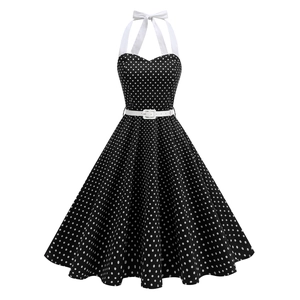 Retro black polka dot dress with halter neck, heart-shaped neckline and white waist belt