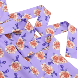 Detail shot of lavender floral chiffon waist belt with orange rose print and soft texture