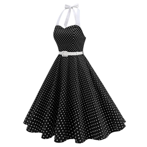 Detailed view of the halter neck heart-shaped neckline and polka dot pattern fabric