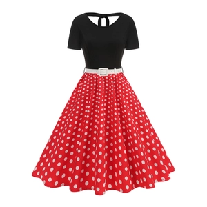 Retro 1950s polka dot dress with black bodice, red flared skirt and white waist belt