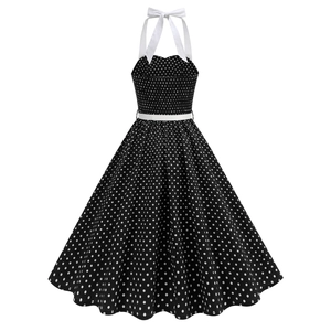 Detail of retro polka dot halter dress with smocked bodice and white ribbon neckline